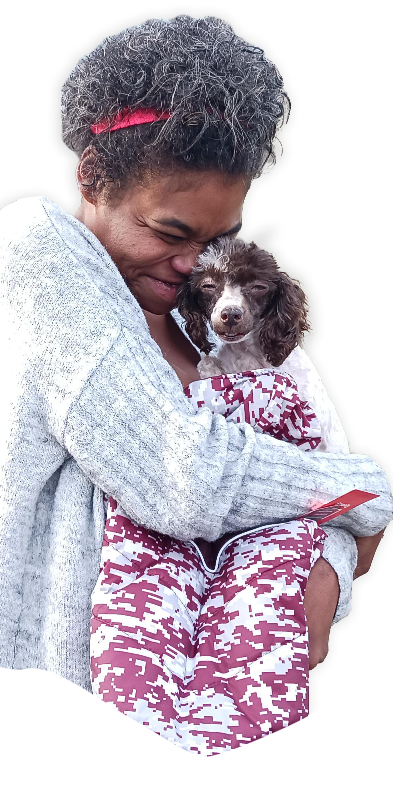 Woman hugging small dog